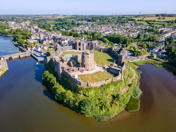 Aerial view of Pembroke Castle in Pembrokeshire, a major medieval fortress surrounded by water